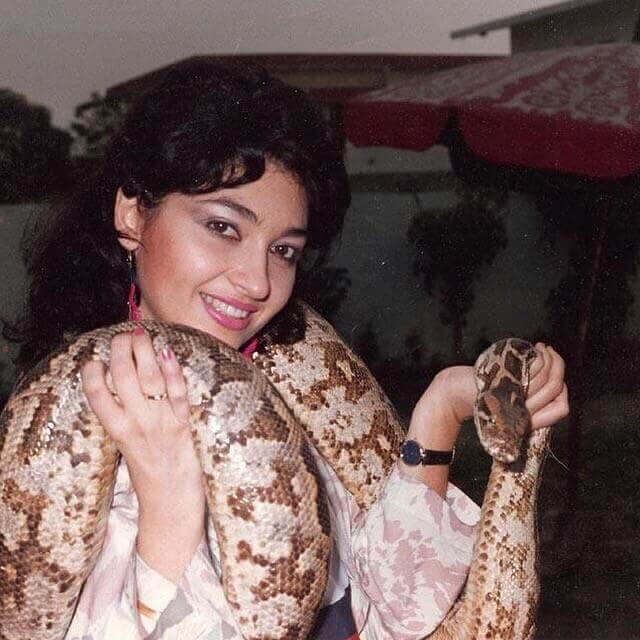 Nazan Saatci with a snake during a shoot in Pakistan